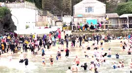 Hundreds gather in Cornwall for a swim in cold water to raise money for charity