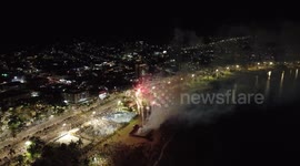 Aerial footage of New Year's Eve celebration with fireworks on Caraguatatuba beach in Brazil