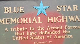 This bridge heading into the woods at the rest area on the highway