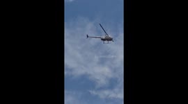 Chopper flying over a São paulos neighborhood looking for robbers
