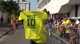 People flock to Vila Belmiro Stadium as Pele's coffin arrives in Santos, SP, Brazil
