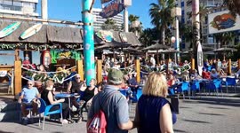Christmas day 2022 in Benidorm, Spain British tourists enjoying the hot weather in their xmas outfits.
