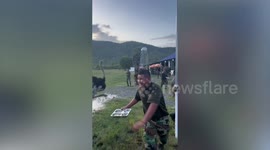 Ostrich causes chaos and scares soldiers while chasing dog during army drill