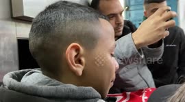 Palestinian Popular Front for the Liberation of Palestine militants carry the body of 15-year-old Adam Ayyad during his funeral procession at Bethlehem's Dheisheh refugee camp in the West Bank