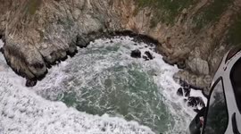 Four people rescued, including two children, after Tesla plunges off cliff in California