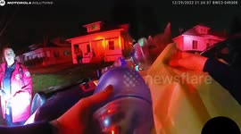Michigan troopers give rescued dog oxygen after saving it from house fire