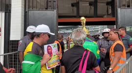 Mourners are let inside Vila Belmiro stadium to Pele's wake in Santos, Brazil