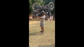 Unique record of holding 250 kg bike on shoulder and fastest running for 100 metre