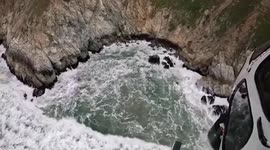 Family rescued after driver 'deliberately plunges Tesla 300ft down cliff' in California