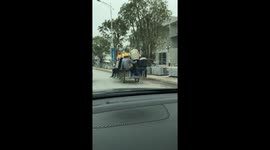 A series of tricycles carrying overloaded people on the streets of Vietnam
