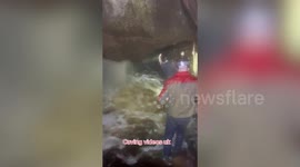 Terrifying moment amateur cave explorers narrowly escape from flooding tunnel