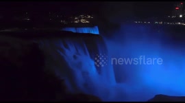 Niagara Falls illuminated blue in support of critically hospitalized Buffalo Bills player Damar Hamlin