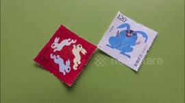 A Citizen Shows Chinese Zodiac Stamp In Yichang, China