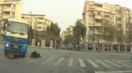 Dashcam captures motorcyclist's miraculous escape in truck crash