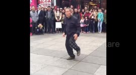 Elderly man shows off hip-hop dancing skills with professional dancers