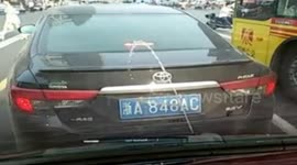 Troll windscreen washer fires water onto the car in front