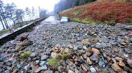 Car trapped between two landslides after UK storm