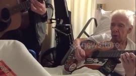 Famous guitarist George Cole jams with his old guitar teacher in hospital