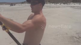 Man catches 8ft-long shark