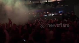Clubbers sing football chant during DJ set