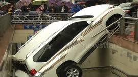 Woman saved after backing SUV into subway