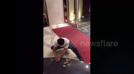 Man smashes cobbles with hands
