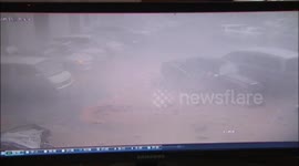 Wall collapses and damages eight cars in a parking lot