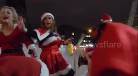 Hundreds of drunken Santas take over London