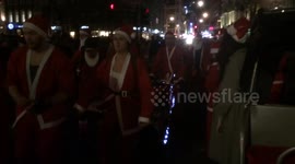 Rollerblading Santas parade through London