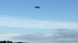 Coastguard helicopter Searches for missing sailor off a ship