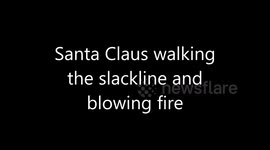 Santa Claus Walking Slackline and Breathing Fire