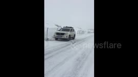 SUV loses control and keeps spinning on snowy road