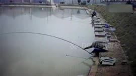 Fisherman loses epic battle with fish and ends up in the water