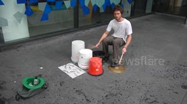 Man busks with found buckets to fund New Zealand travels