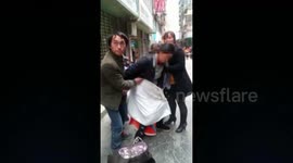 Woman gives birth on busy street in China