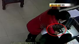 Brave woman sneaks iPhone in her pocket at police station