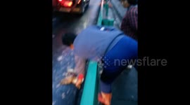 Villagers scramble for ducks after truck crashes on highway