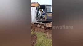 Boy skilfully operates digger while working for parents in China