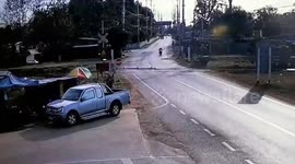Pickup truck drives through level-crossing barrier killing one in Thailand