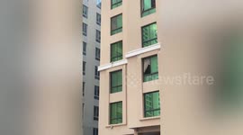 Troubled neighbour throws clothes and objects from her 4th-floor room window in Bahrain