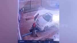 Bungling car wash worker falls into garage inspection pit in Cambodia