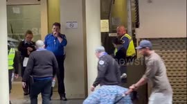 City of Sydney council ranger appears to break no smoking law to have a puff beside 'no smoking' sign