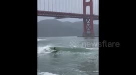 Surfers ride high waves as bomb cyclone slams Northern California, US