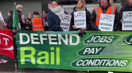 Workers gather outside Euston as rail strikes continue
