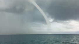 Frantic fishermen prays as he flees from enormous waterspout in the Philippines