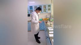 Doctors work while hooked up to IV drips during COVID-19 surge in China