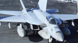 US Naval Crews Perform Flight Operations Aboard The USS Nimitz Supercarrier