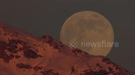 'Full wolf' moon rises spectacularly over Swiss Alps