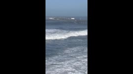 Monster Waves under pier in California Storm