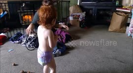 Baby girl moved by the music doesn't let anything stop her from dancing.